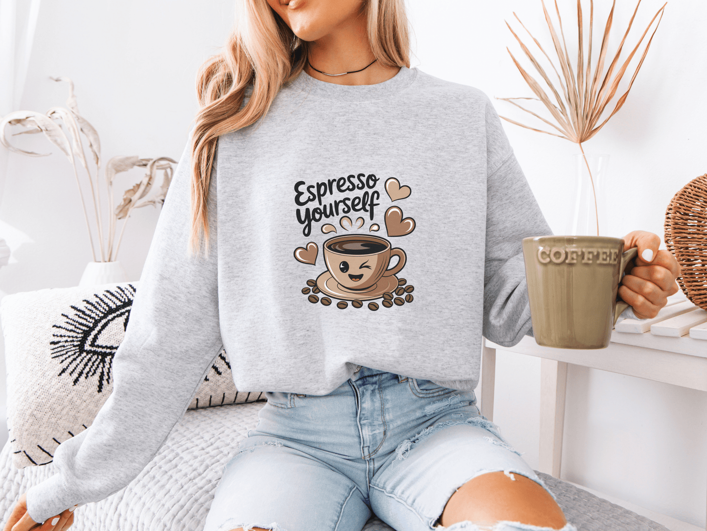 Woman in light ash gray “Espresso Yourself” sweatshirt holding a green coffee mug