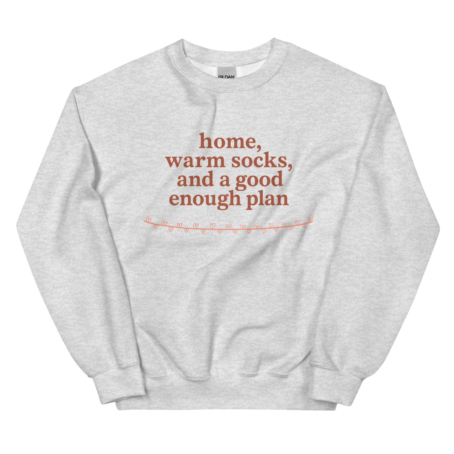 Gray sweatshirt with red text "home, warm socks, and a good enough plan" on a white background