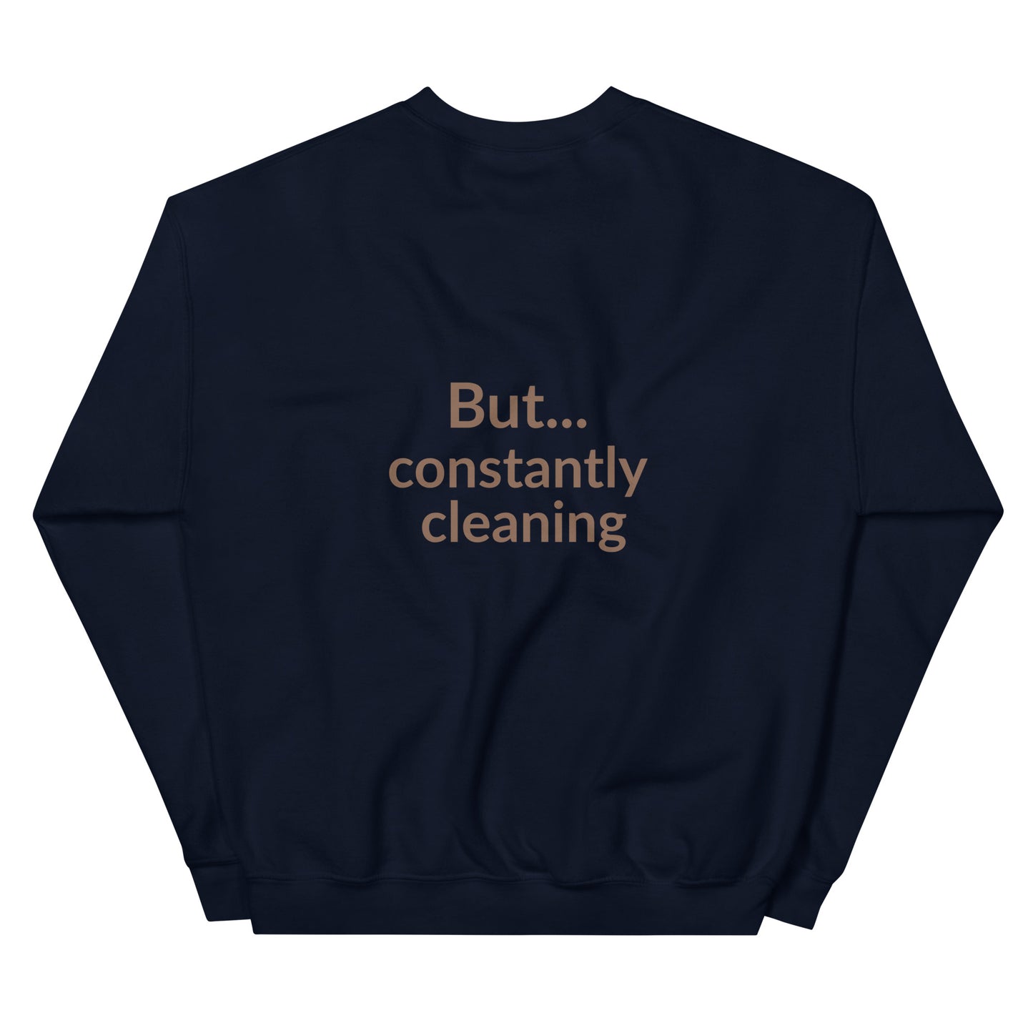 Navy blue sweatshirt with text 'But... constantly cleaning' on a white background