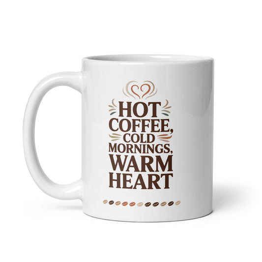 White mug with text 'Hot coffee, cold mornings, warm heart' on a white background