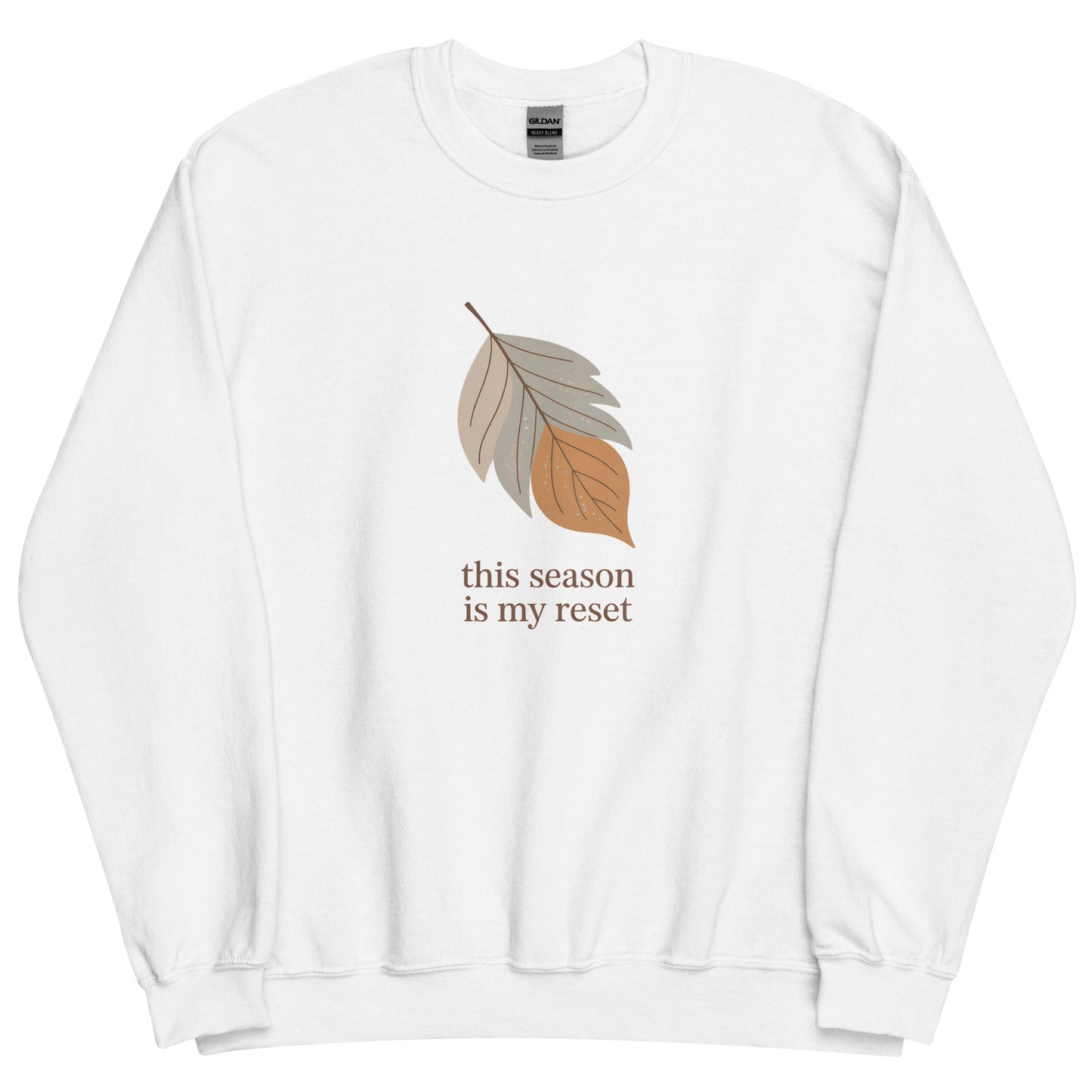White sweatshirt with a leaf graphic and text "this season is my reset" on a white background