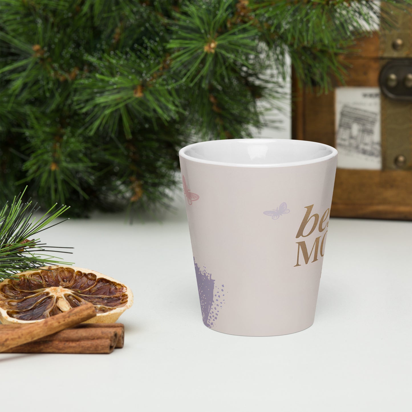 Best Mom Ever latte mug styled with Christmas greenery – cozy holiday gift