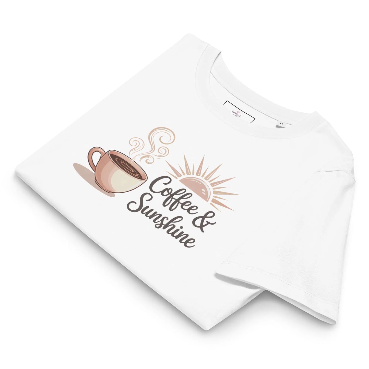 Flatlay of white organic cotton t-shirt with “Coffee & Sunshine” design. Cozy summer mom shirt on a soft background.