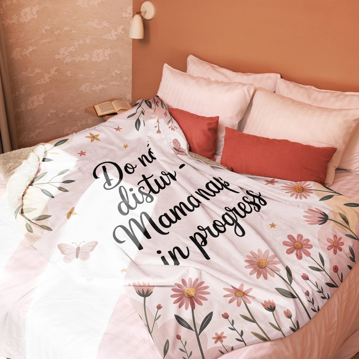 “Mama nap in progress” blanket on blush-toned bed, cozy pastel floral decor style - large blanket.