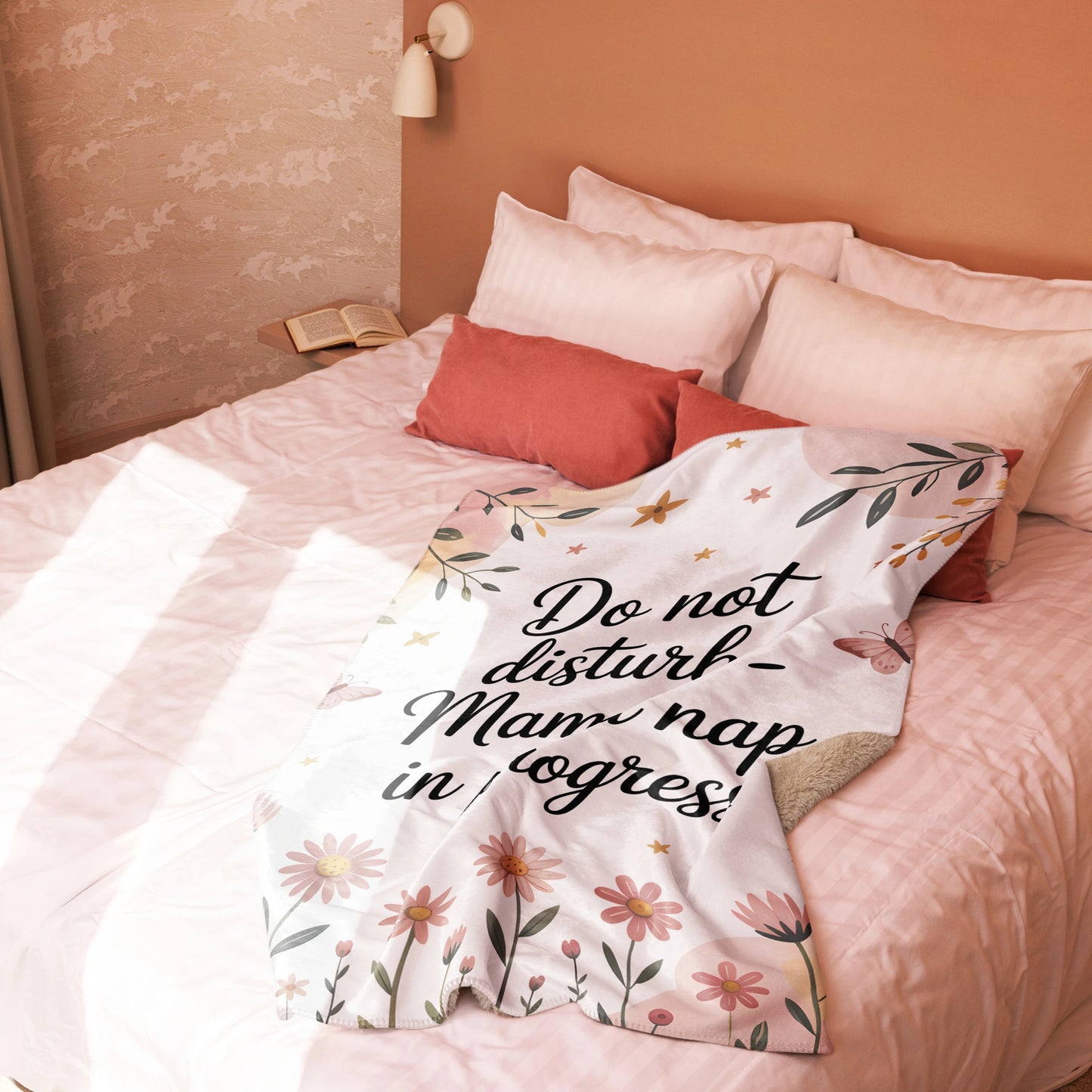 “Mama nap in progress” blanket on blush-toned bed, cozy pastel floral decor style-small blanket.