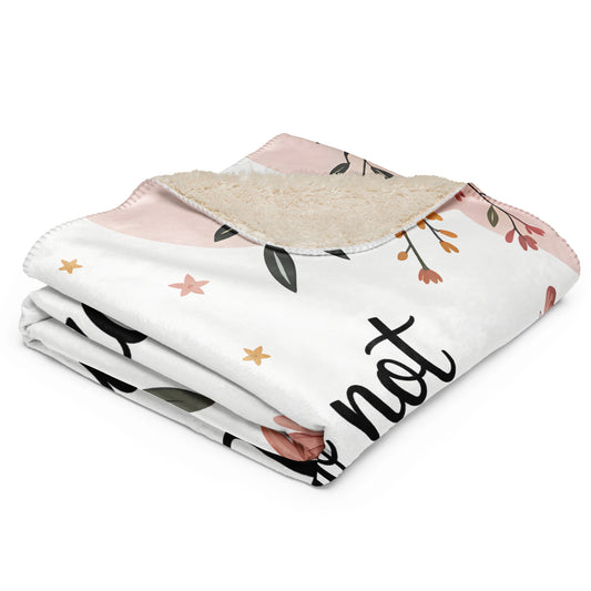 Pastel floral sherpa blanket folded, showing soft cream back and quote “Mama nap in progress”.
