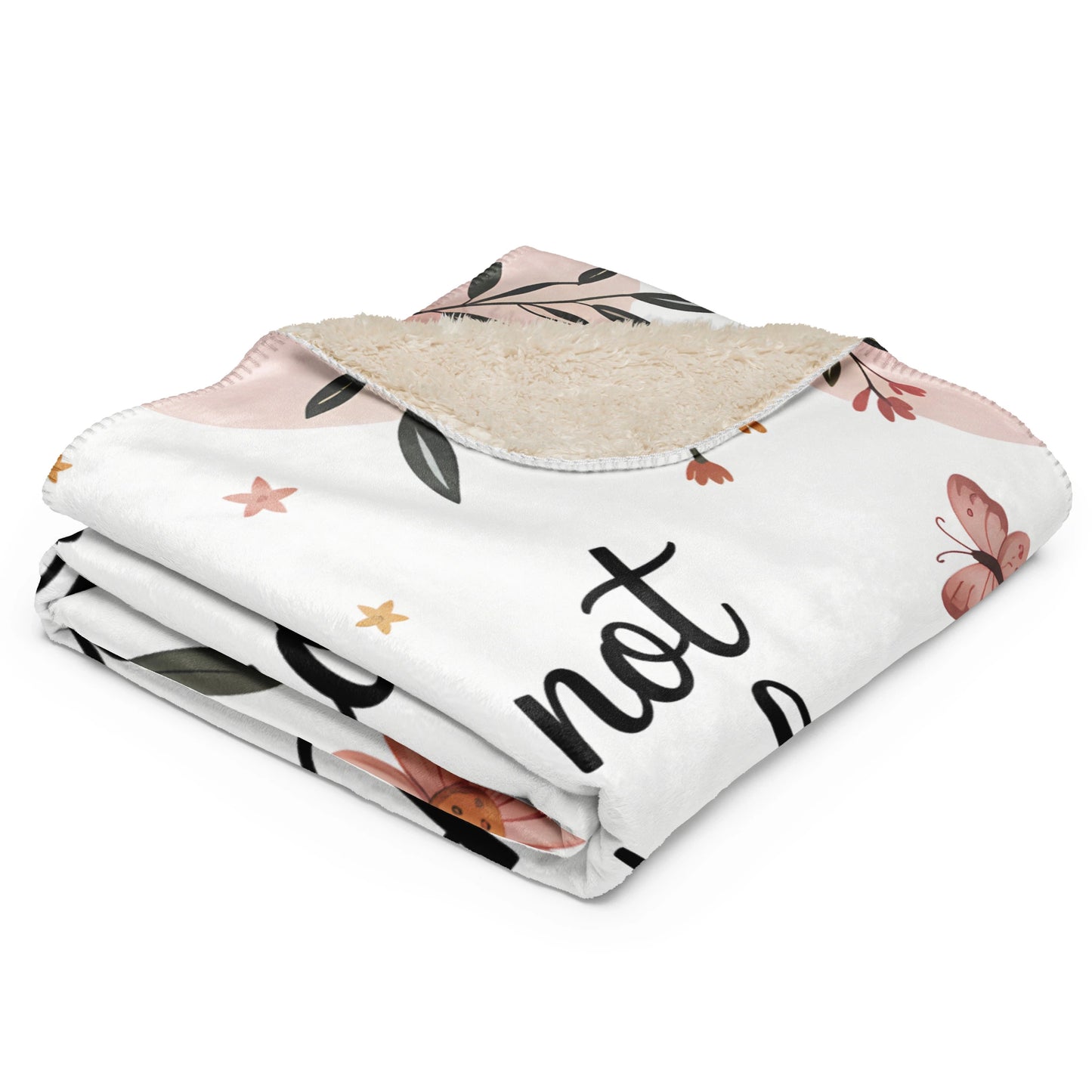 Pastel floral sherpa blanket folded, showing soft cream back and quote “Mama nap in progress”.