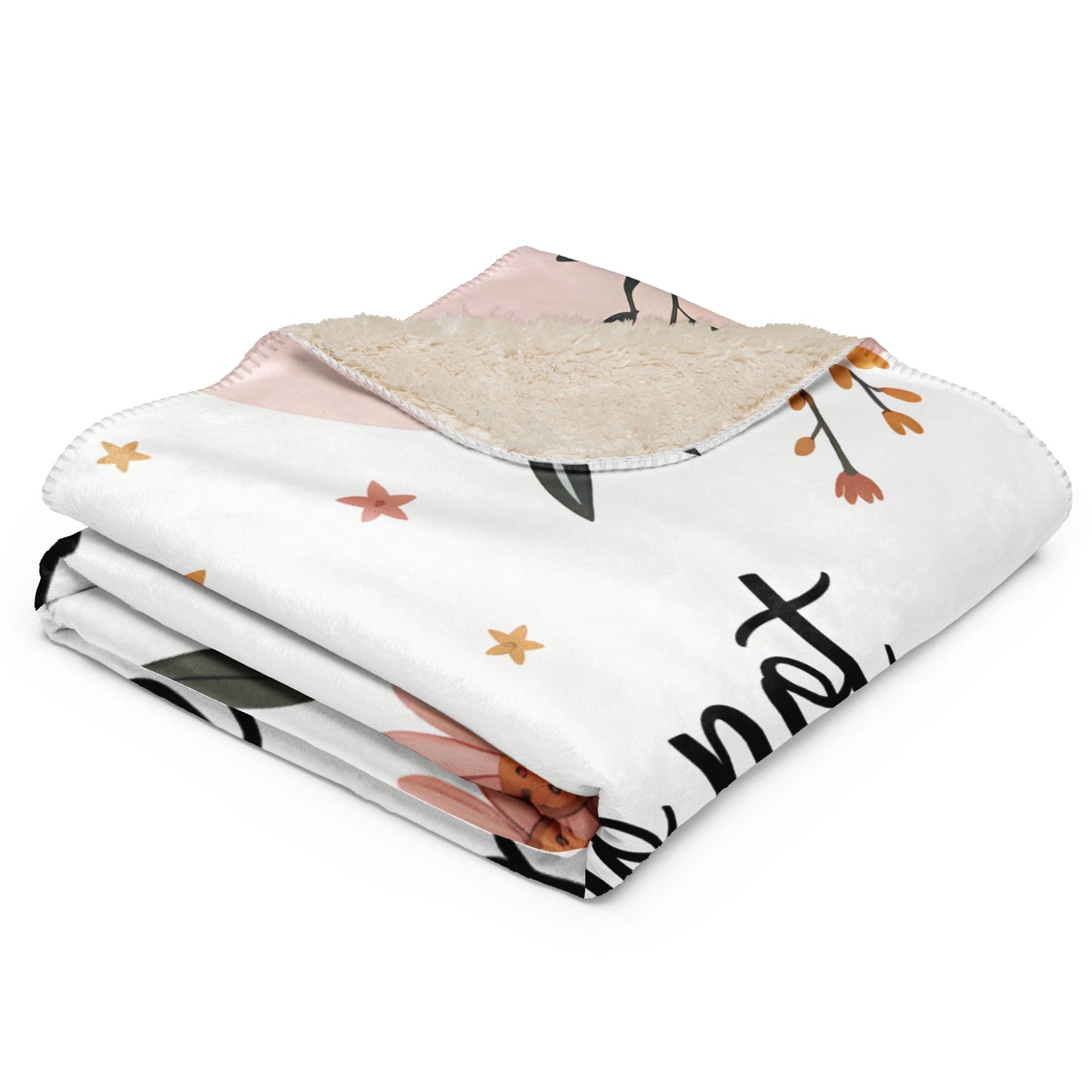 Pastel floral sherpa blanket folded, showing soft cream back and quote “Mama nap in progress”.