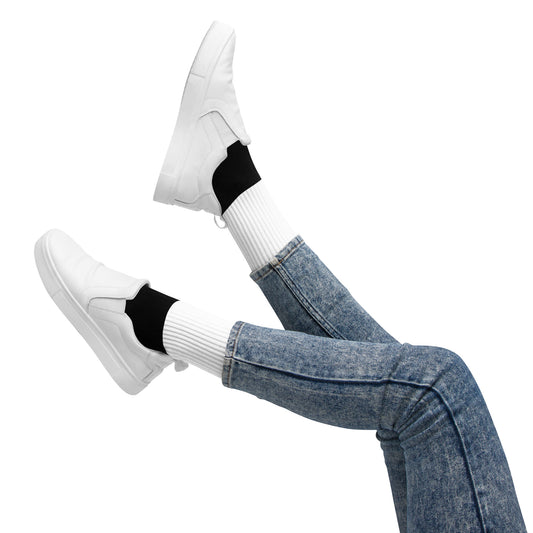 Stylish black and white socks paired with jeans and white sneakers