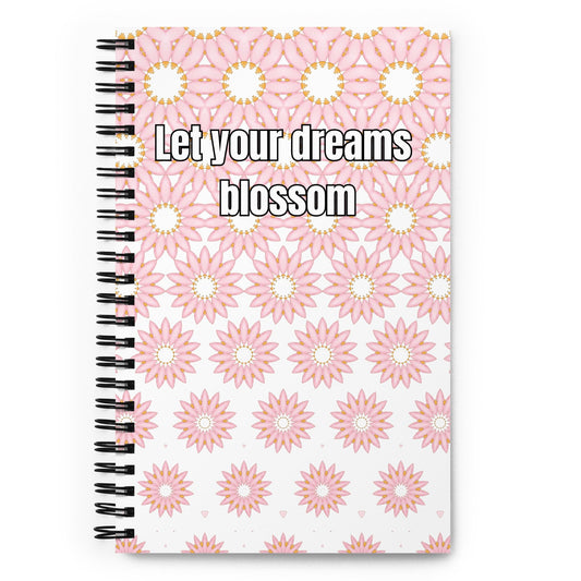 Spiral notebook with “Let your dreams blossom” quote on pink floral cover - white background