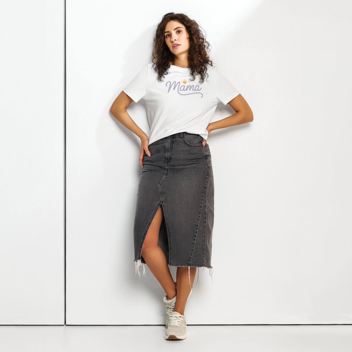 Woman wearing white t-shirt with “Mama” script and sun icon, styled with a denim skirt – minimalist summer mom shirt mockup