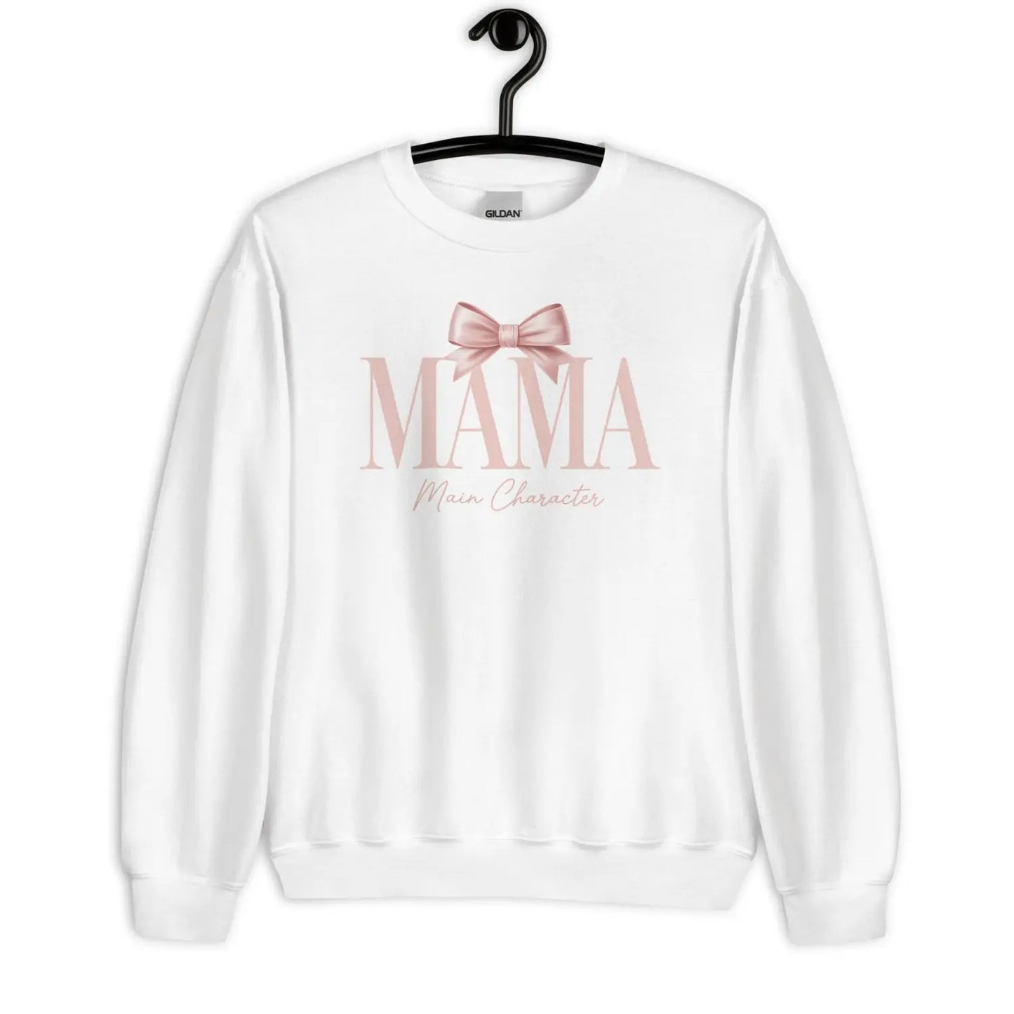 White sweatshirt with 'MAMA Main Character' text and a bow graphic on a hanger against a white background