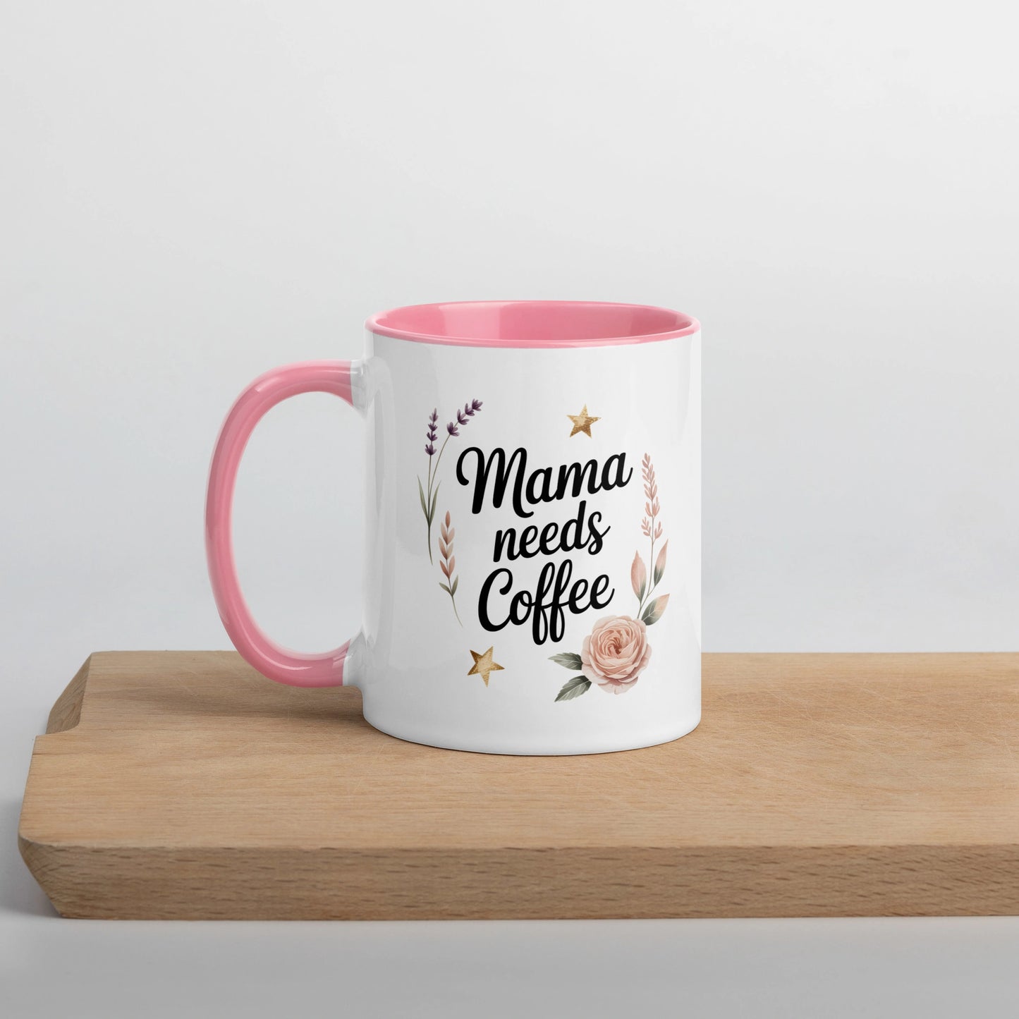 Left-side view of white mug with โMama Needs Coffeeโ quote and soft pink handle.
