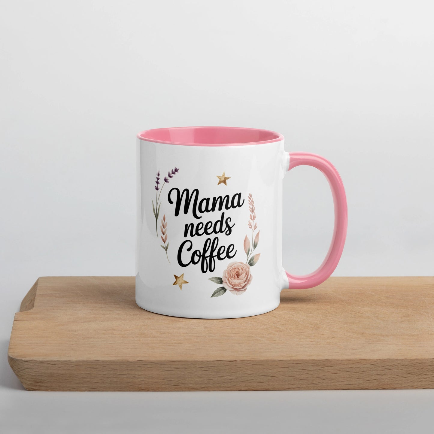 Right-side view of white mug with โMama Needs Coffeeโ quote and soft pink handle.