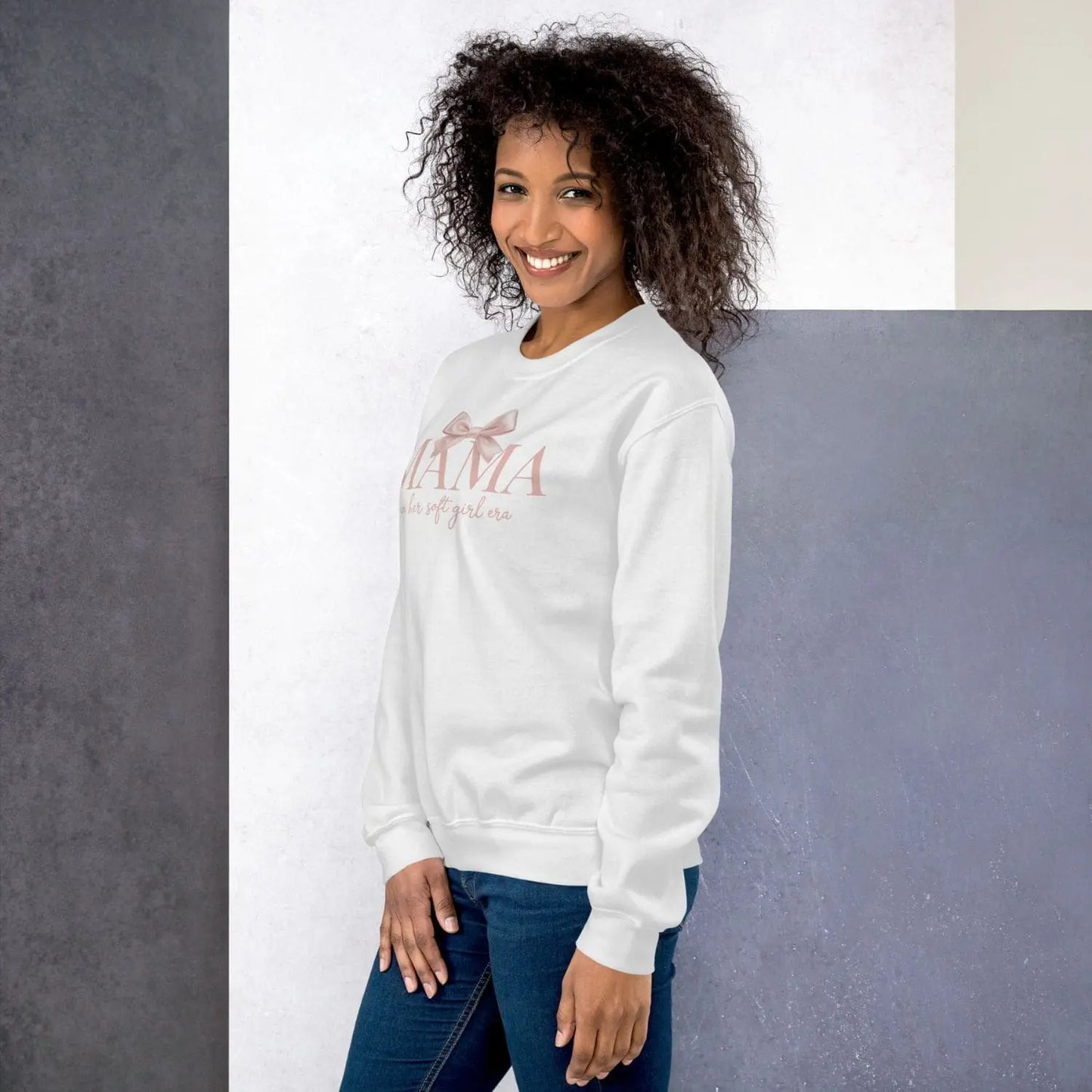 Woman wearing a white sweatshirt with text on a gray background