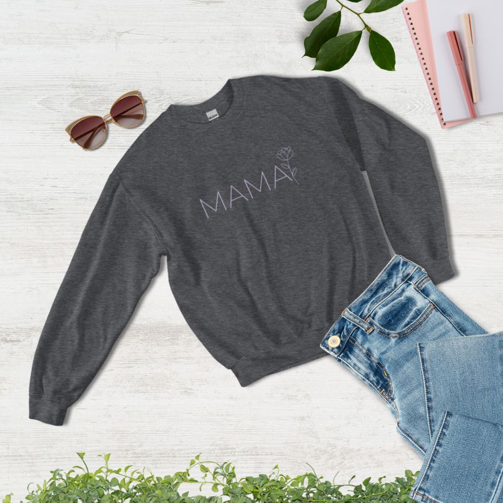 Flat lay of MAMA dark heather sweatshirt styled with jeans, sunglasses, and notebook – cozy and chic gift for moms