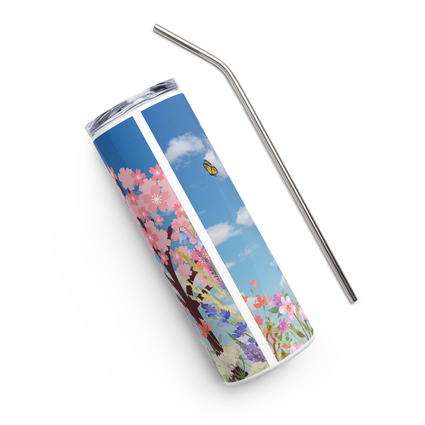 Spring-themed stainless steel tumbler lying on its side with a metal straw beside it, featuring cherry blossoms, butterflies, and a blue sky with clouds on a white background.