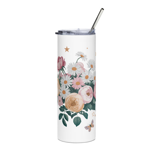 Tall white tumbler with floral and star design, metal straw, placed on a white surface.