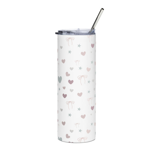 White stainless steel tumbler with pastel heart, star, and bow pattern, shown upright with a metal straw and clear lid, against a white background.
