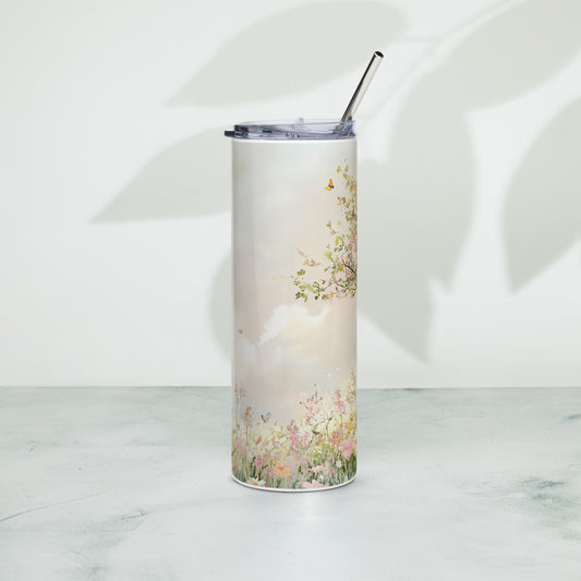 Stainless steel tumbler featuring a dreamy pastel meadow and sky design with butterflies, photographed against a soft neutral background with artistic shadow play.