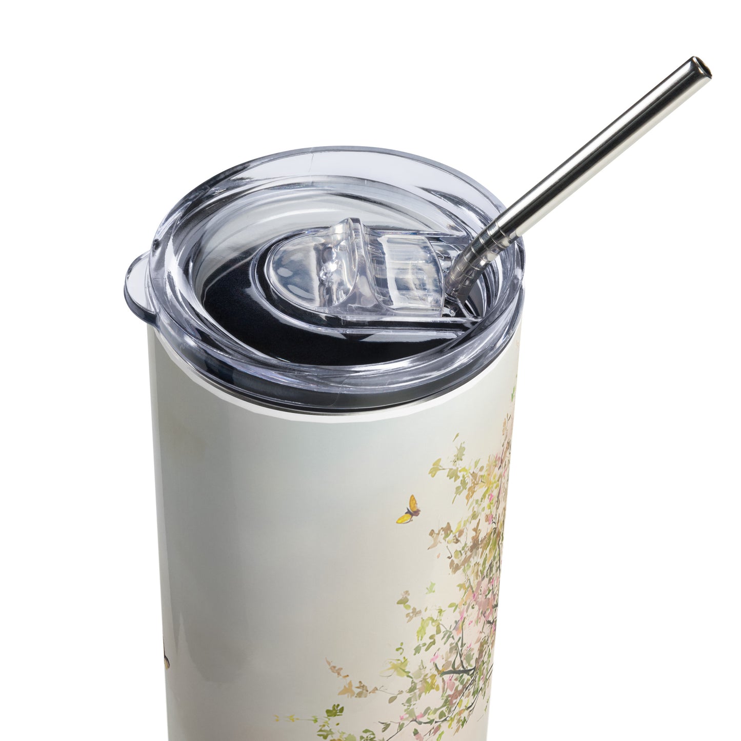 Close-up of a pastel floral stainless steel tumbler with clear lid and metal straw, angled from the top right.