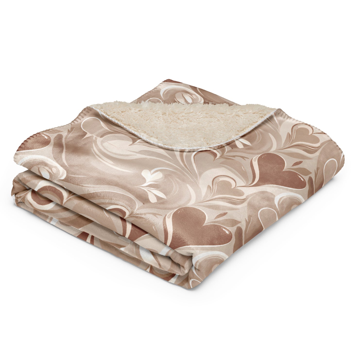 Folded tan sherpa blanket with soft cream coffee swirl pattern and visible fluffy inner lining, displayed on a white background to highlight texture and design details.