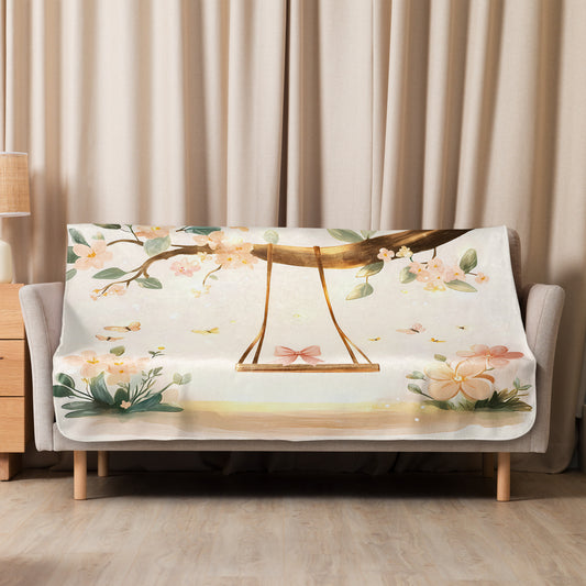 Blossom floral sherpa blanket neatly draped over a modern light gray sofa - medium blanket