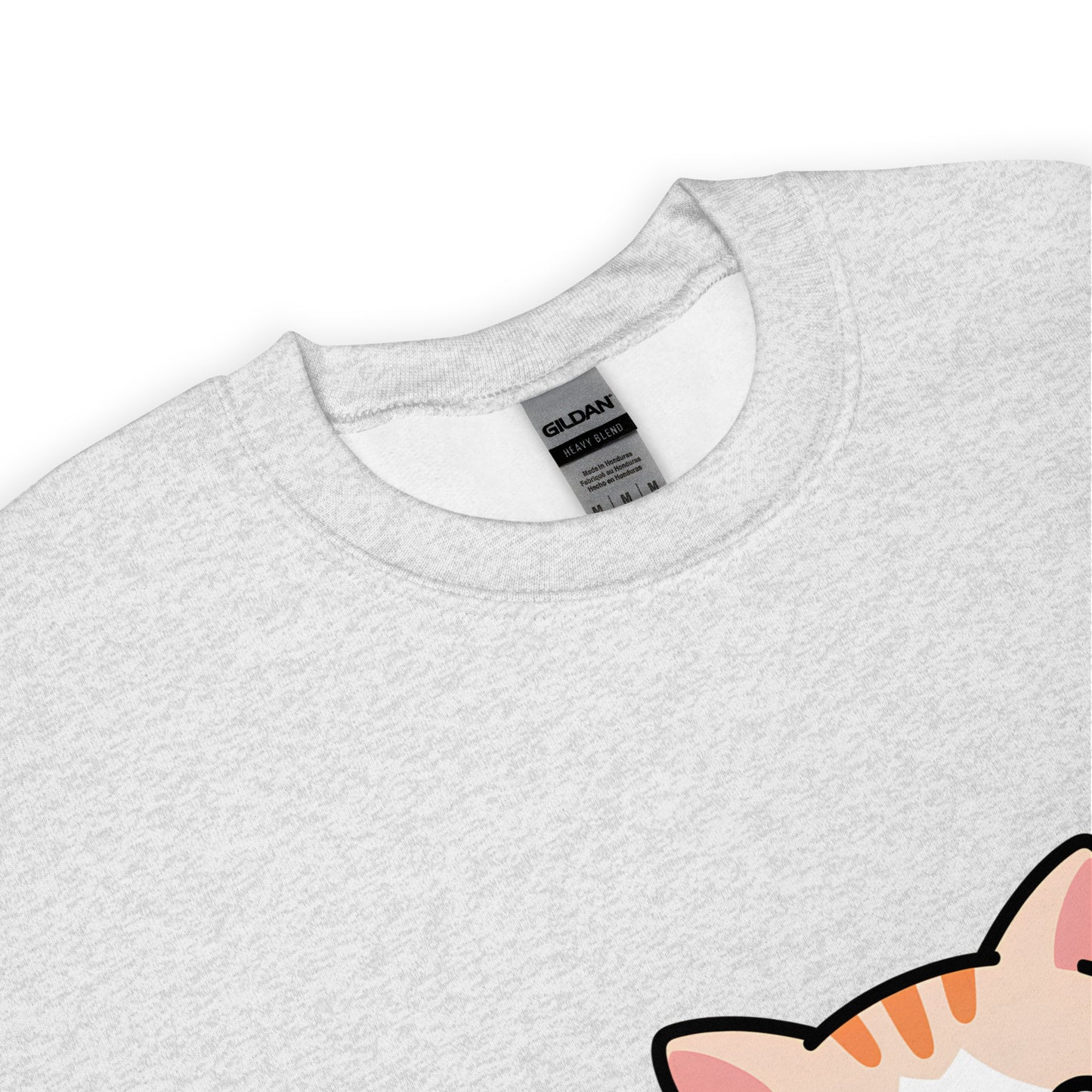 Close-up of ash grey crewneck sweatshirt collar with a partial view of a printed cartoon cat ear.