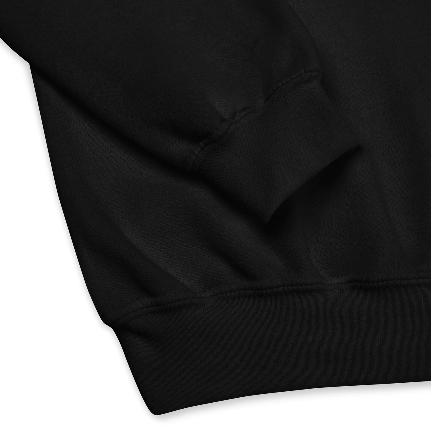 Close-up of the cuff and waistband of a black crew neck sweatshirt, showing the soft fabric texture and stitching details.