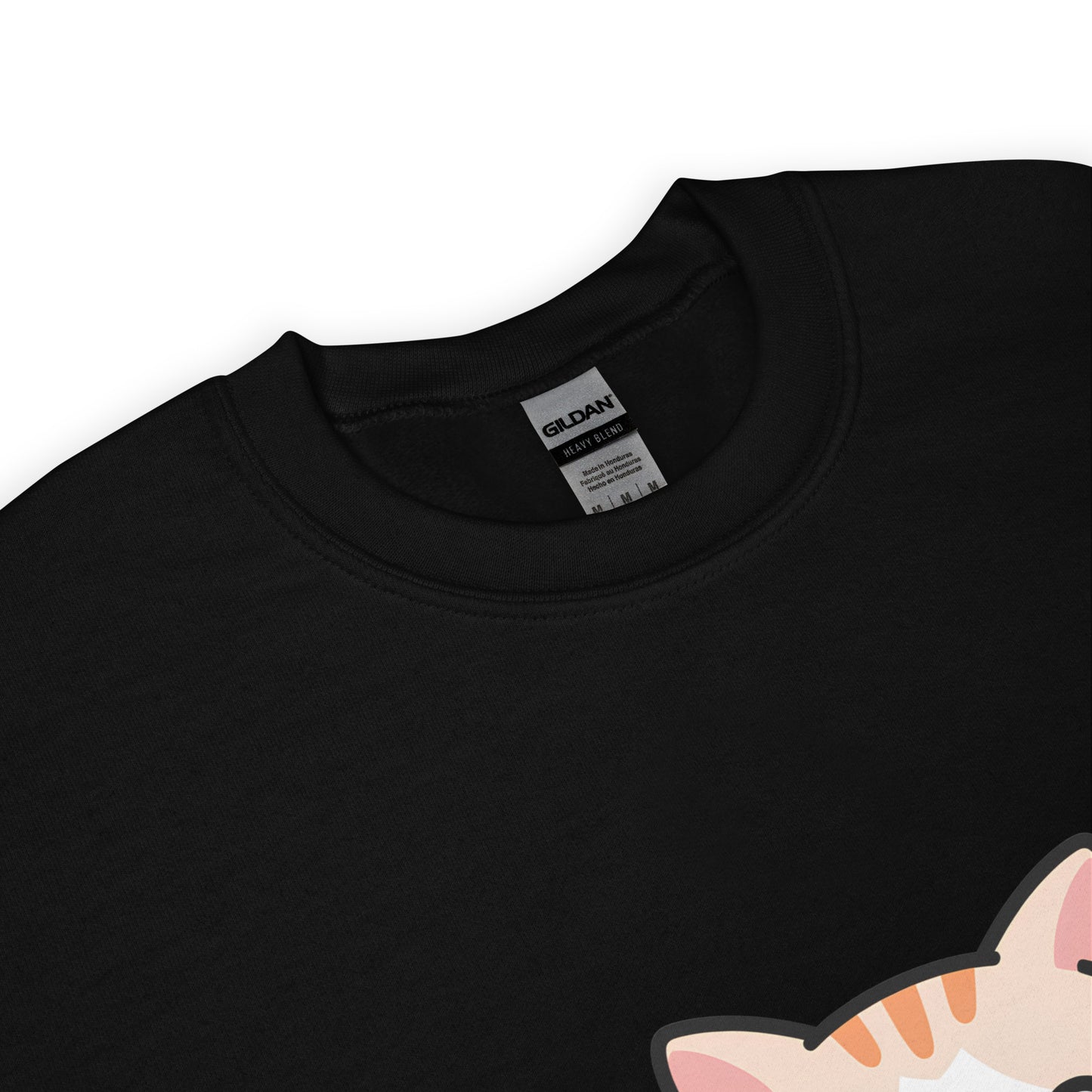 Close-up of black crewneck sweatshirt collar with a partial view of a printed cartoon cat ear.