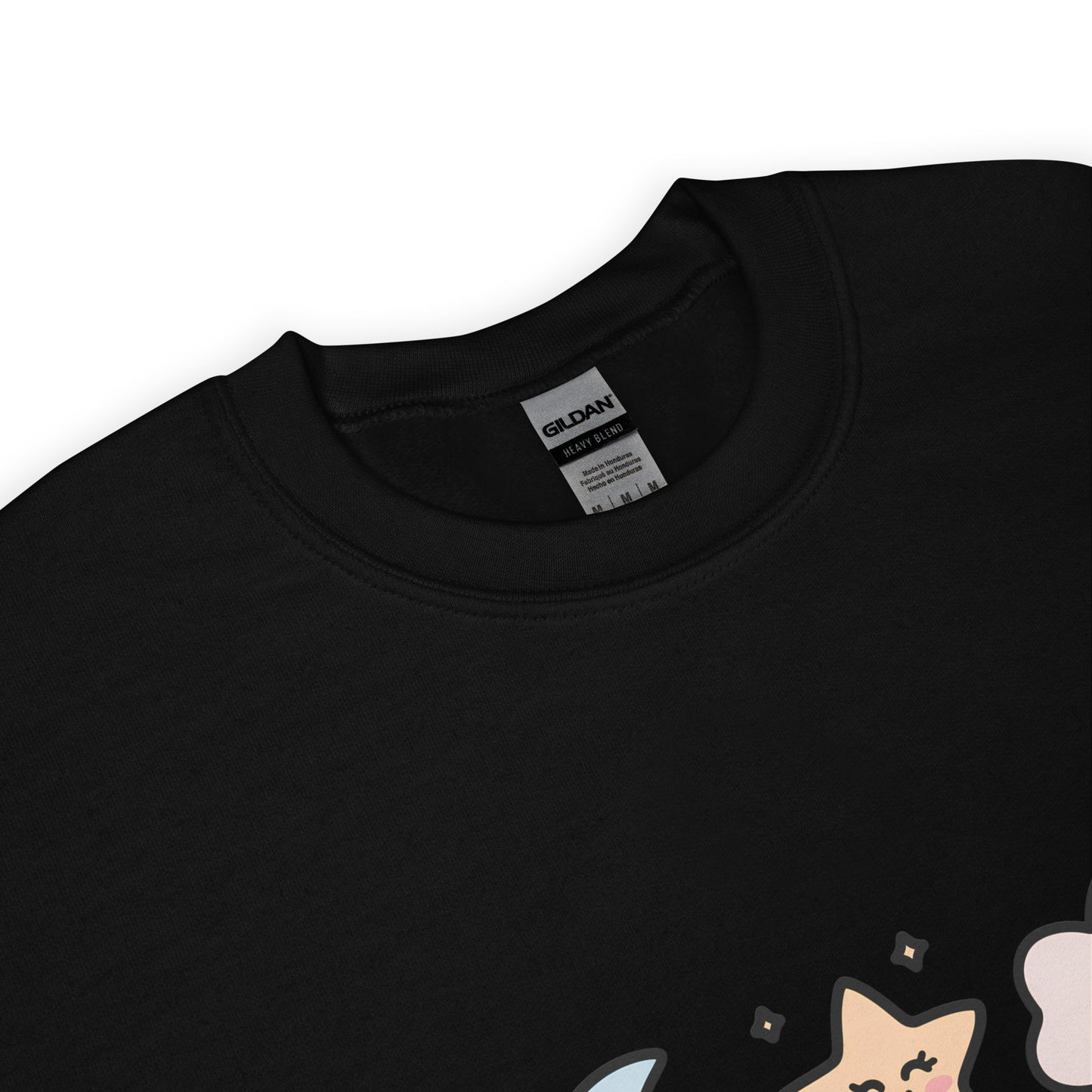 Close-up of the collar and tag of a black Gildan crew neck sweatshirt, with a partial view of a colorful star and cloud design at the bottom edge.