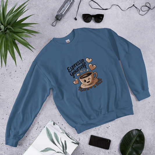 Indigo blue “Espresso Yourself” sweatshirt styled flat lay with sunglasses, water bottle, plant, and notebook – cozy coffee lover gift aesthetic.