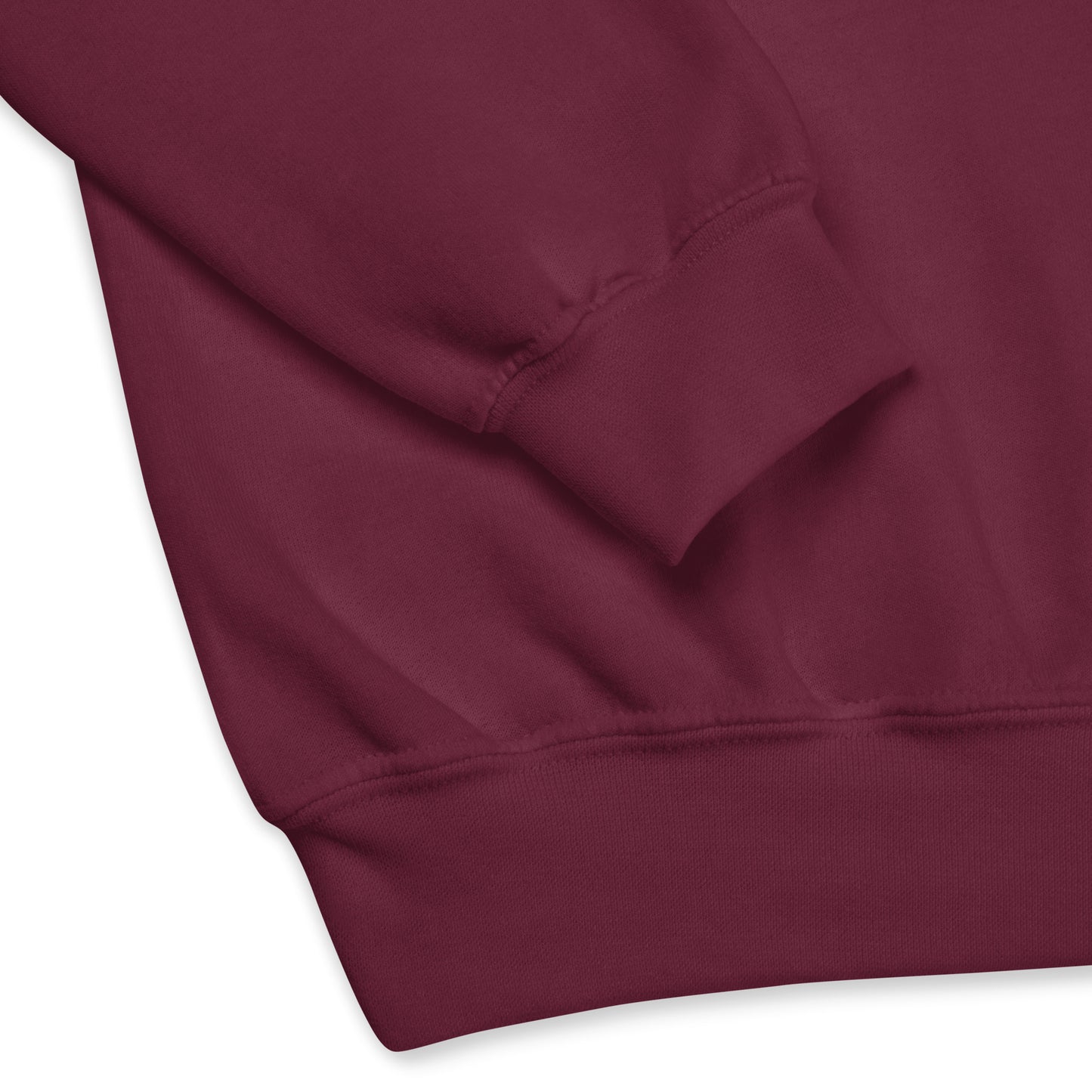 Close-up of the cuff and waistband of a maroon red crew neck sweatshirt, showing the soft fabric texture and stitching details.