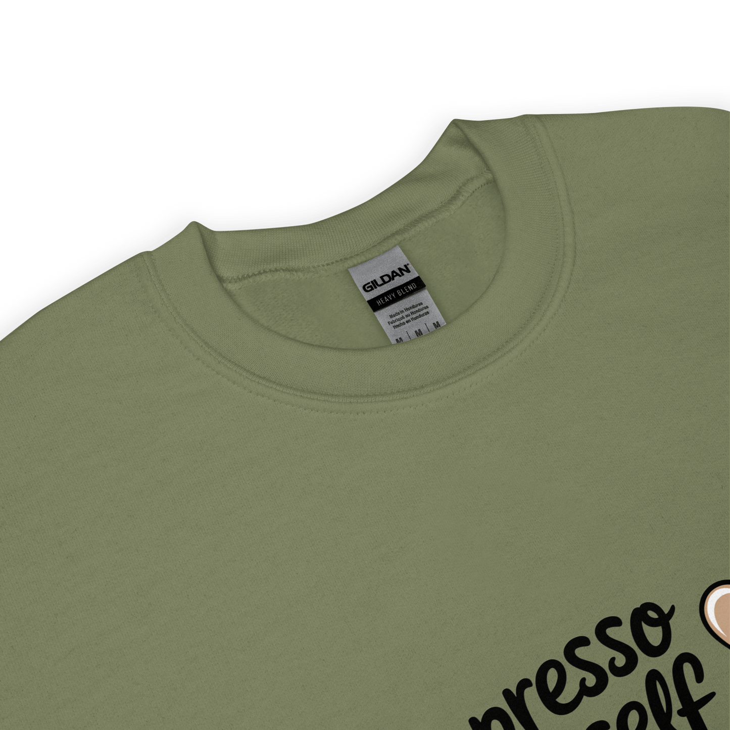 Close-up of a forest green crewneck sweatshirt with the phrase “Espresso Yourself” printed in black cursive font and a small coffee cup illustration on the side.