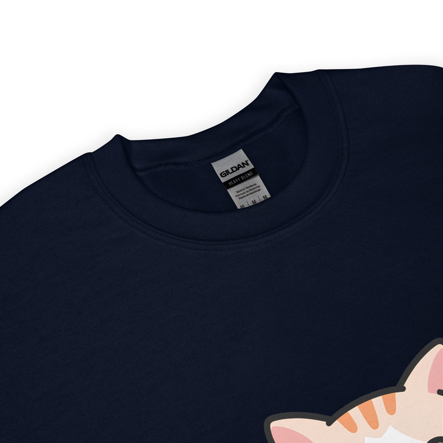 Close-up of navy blue crewneck sweatshirt collar with a partial view of a printed cartoon cat ear.
