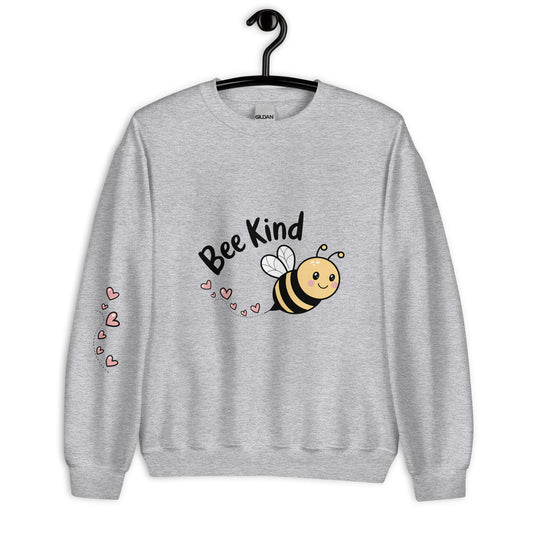Sport grey unisex sweatshirt on hanger with “Bee Kind” design and pink hearts on the sleeve