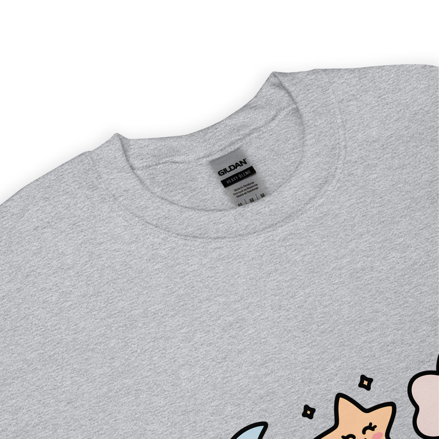 Close-up of the collar and tag of a sport gray Gildan crew neck sweatshirt, with a partial view of a colorful star and cloud design at the bottom edge.