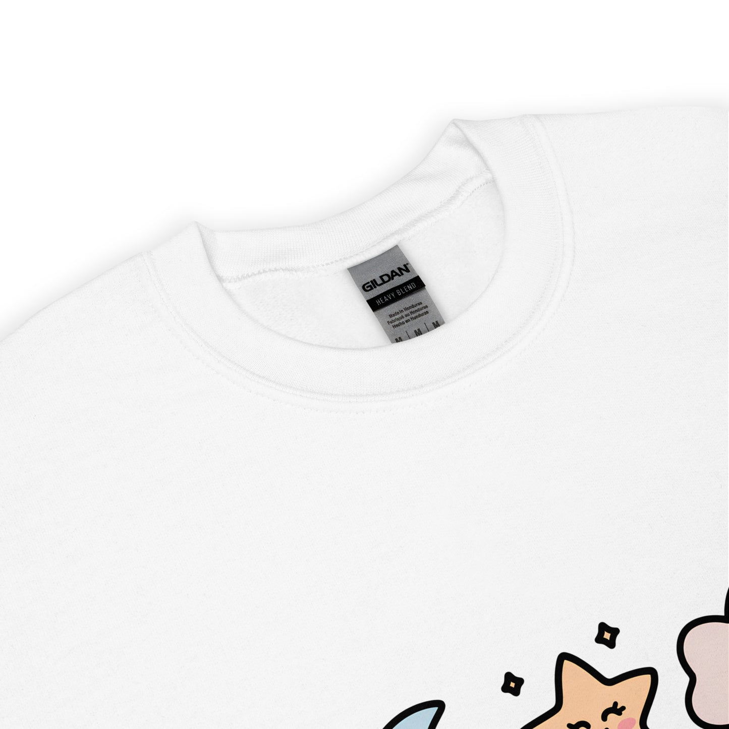 Close-up of the collar and tag of a white Gildan crew neck sweatshirt, with a partial view of a colorful star and cloud design at the bottom edge.