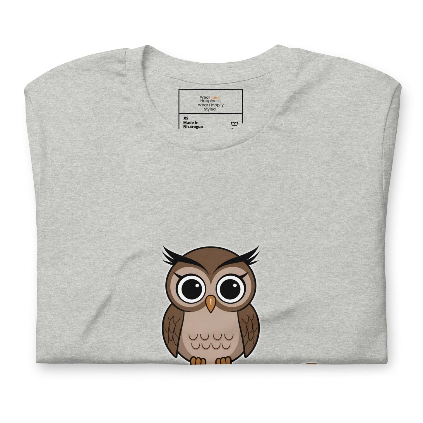 Close-up of a gray t-shirt with a cute cartoon owl graphic peeking from the bottom – whimsical and fun design for owl lovers.