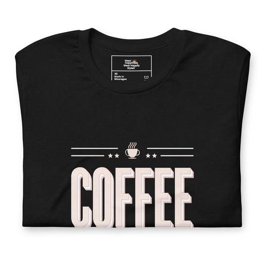 Folded black t-shirt with bold “COFFEE” typography and steam cup graphic — flat lay product mockup for coffee lovers.