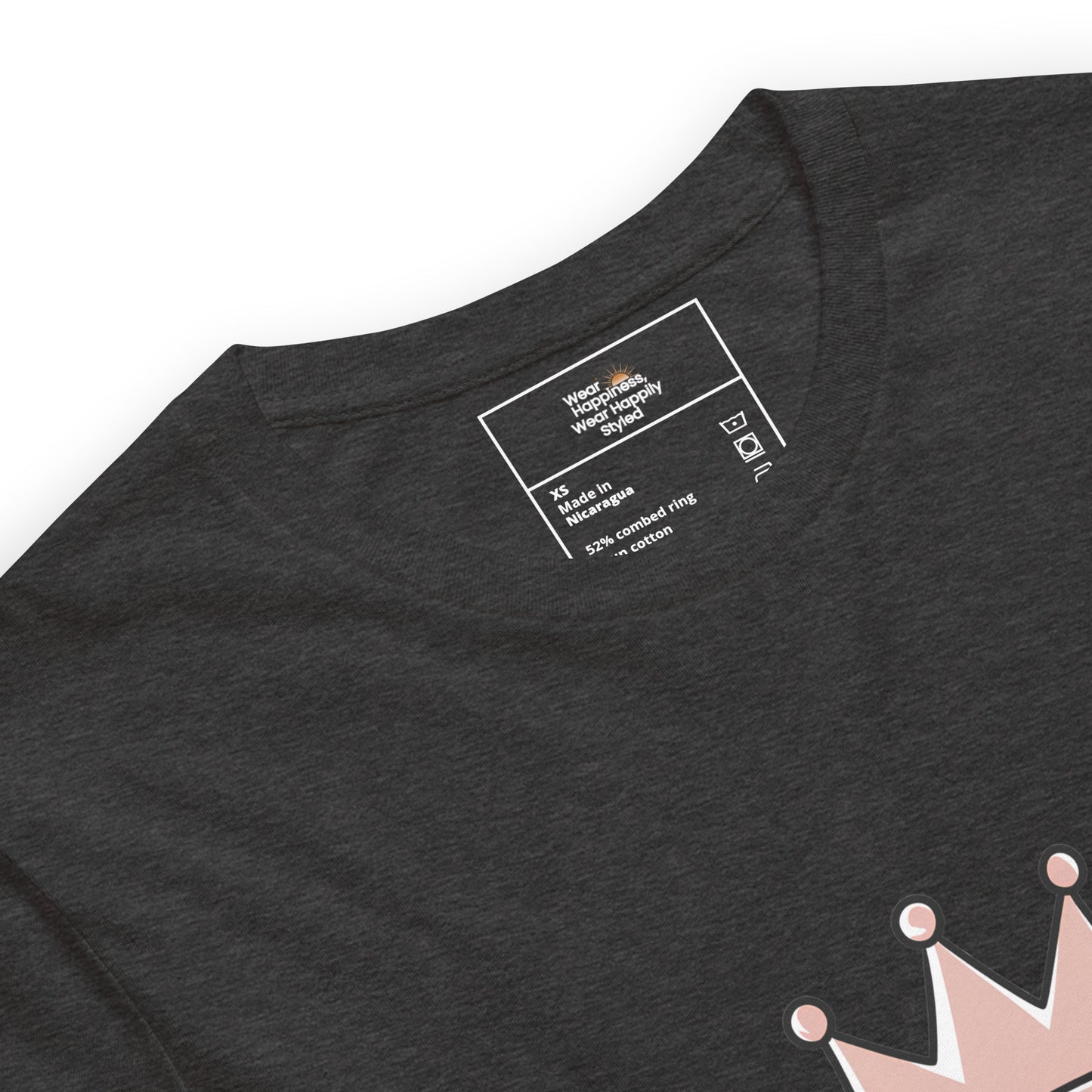 Close-up of a heather dark grey unisex t-shirt showing printed inner label and partial “Caffeine Queen” crown design