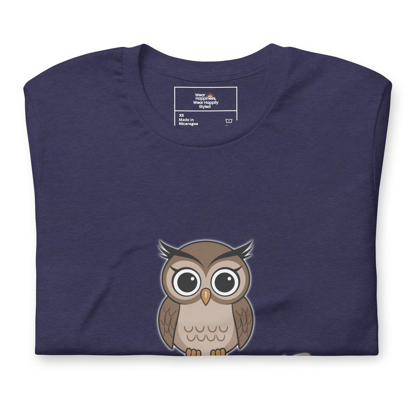 Close-up of a navy blue t-shirt with a cute cartoon owl graphic peeking from the bottom