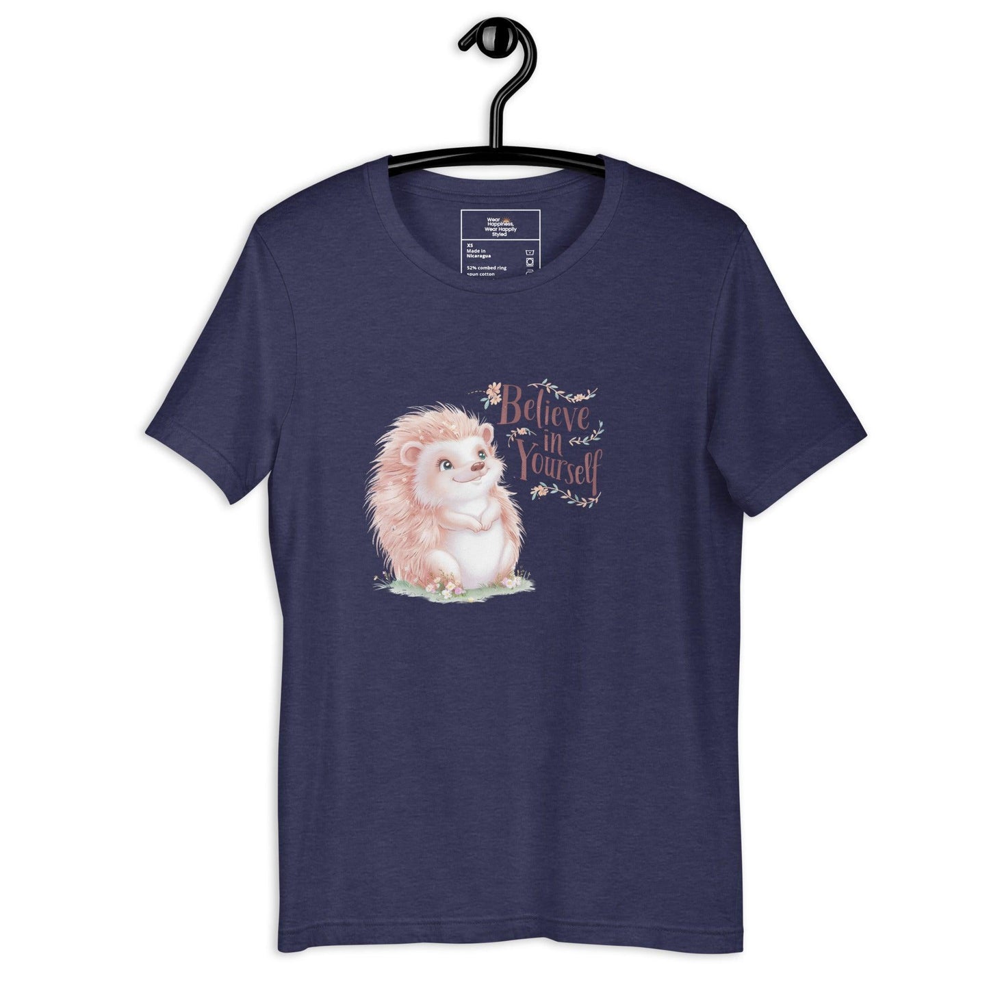Hanging navy t-shirt with a pastel hedgehog and “Believe in Yourself” quote