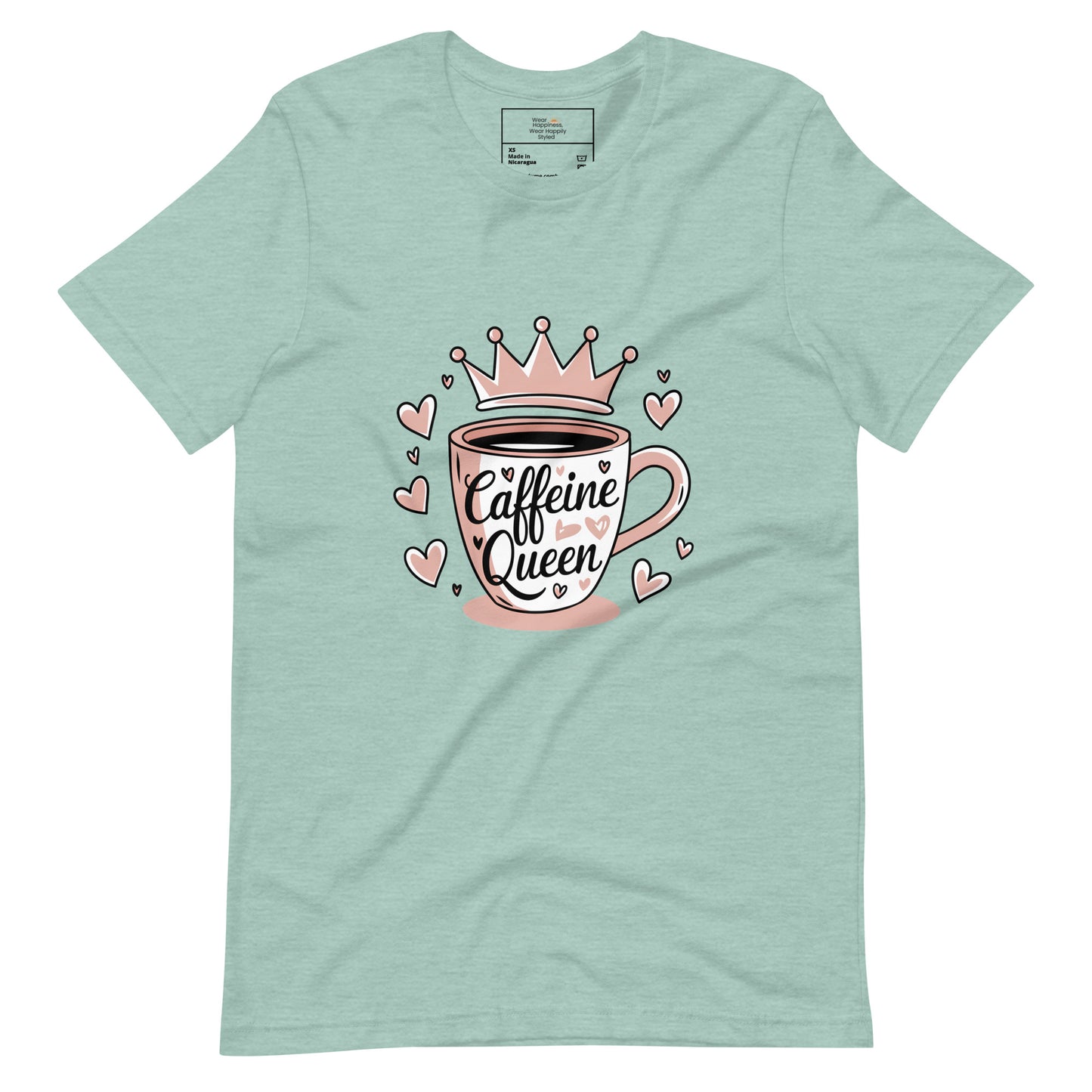 Flat lay of a heather dusty blue unisex t-shirt with a cute pink “Caffeine Queen” coffee cup design, placed on a white background