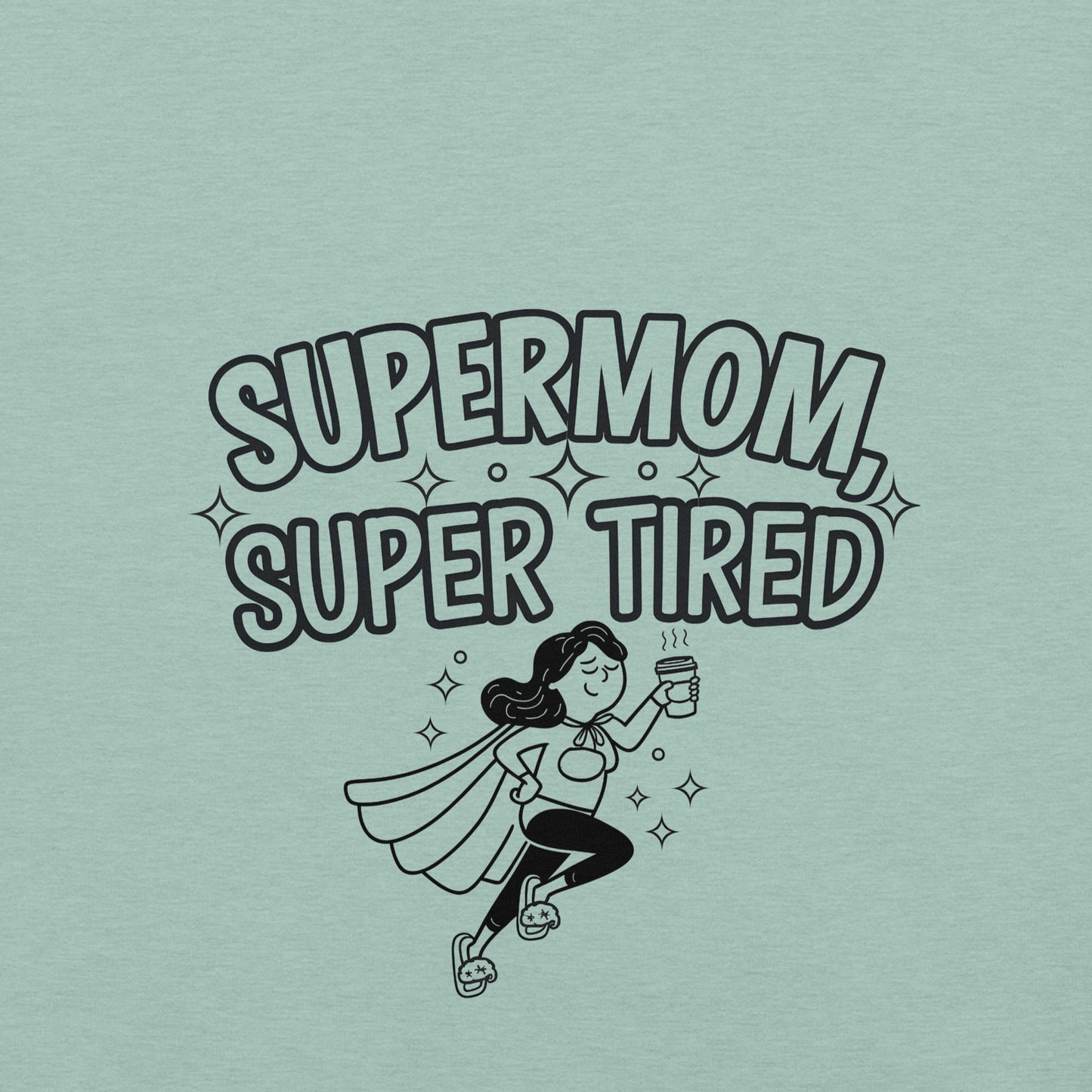 Close up of a prism dusty blue t-shirt with a playful "Supermom, Super Tired" featuring a flying tired mom holding coffee.