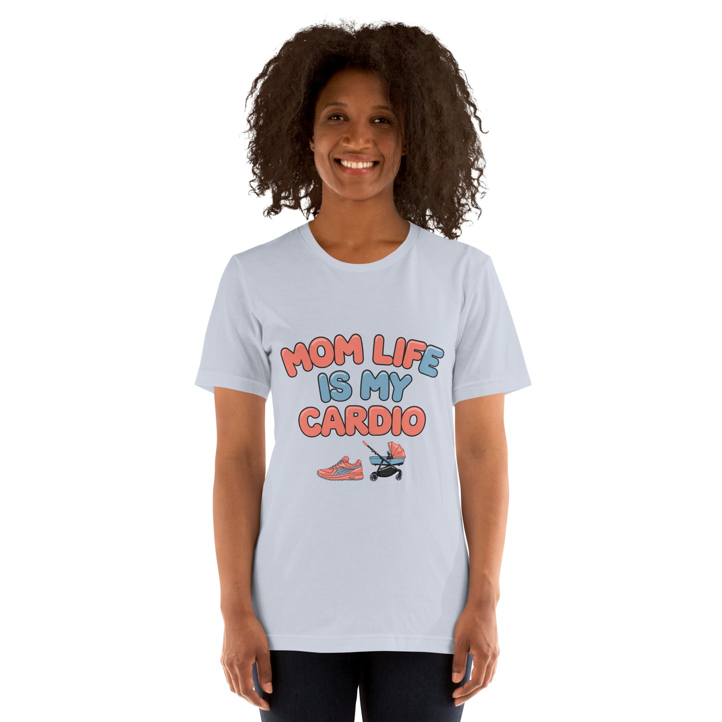 Smiling woman wearing a light blue unisex t-shirt with pastel text that says 'Mom Life Is My Cardio' and graphics of sneakers and a pacifier, standing against a white background