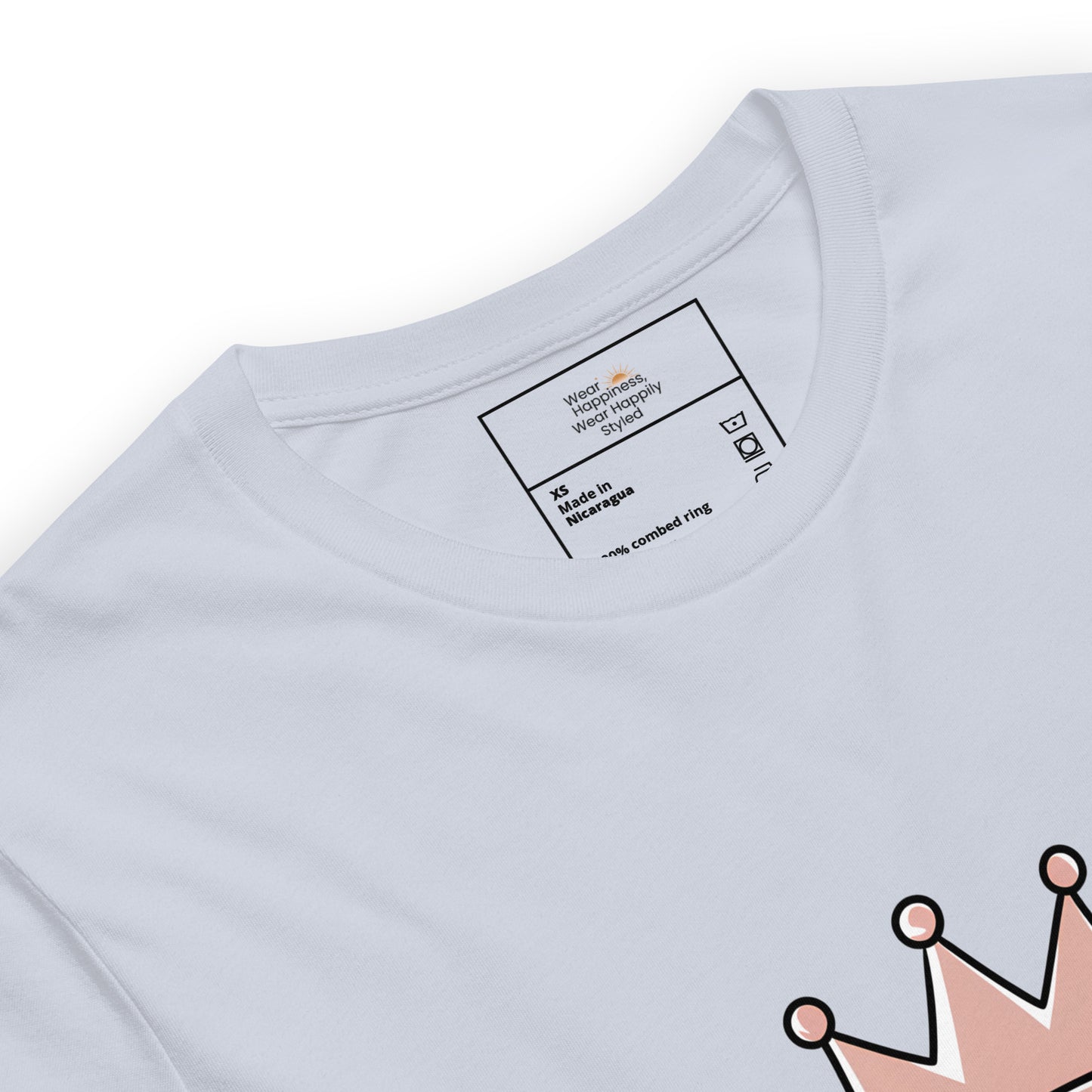 Close-up of a light blue unisex t-shirt showing printed inner label and partial “Caffeine Queen” crown design