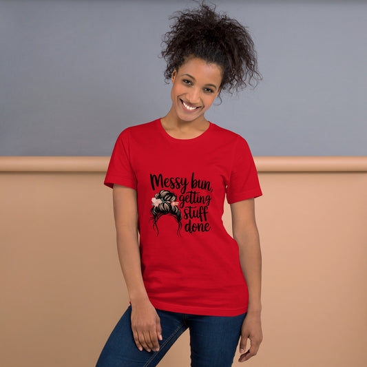 Smiling woman wearing a red t-shirt with black text that says 'Messy Bun, Getting Stuff Done' and a messy bun illustration
