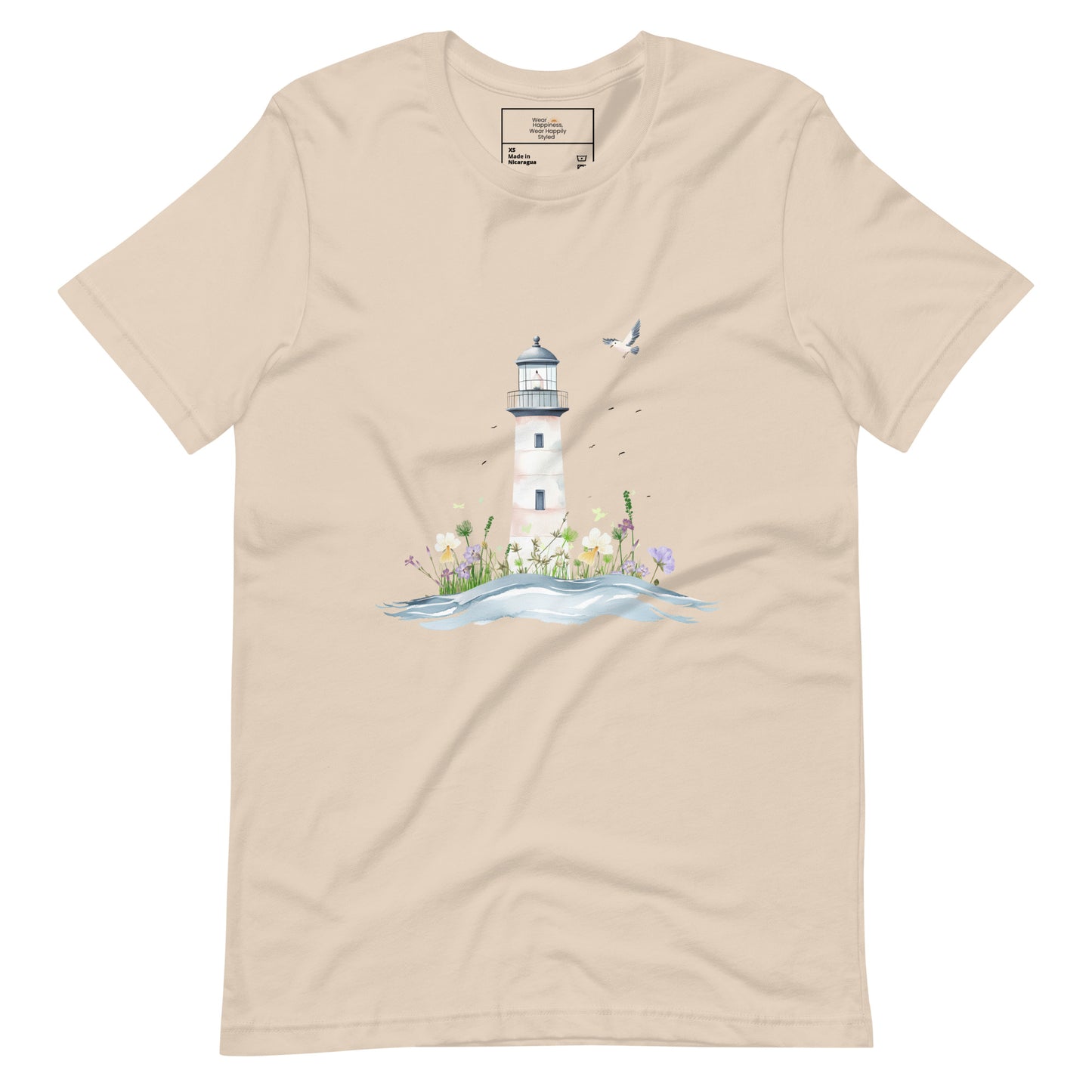 Soft cream-colored t-shirt laid flat featuring a serene lighthouse illustration with floral details and a seagull in flight, designed for peaceful mom style.