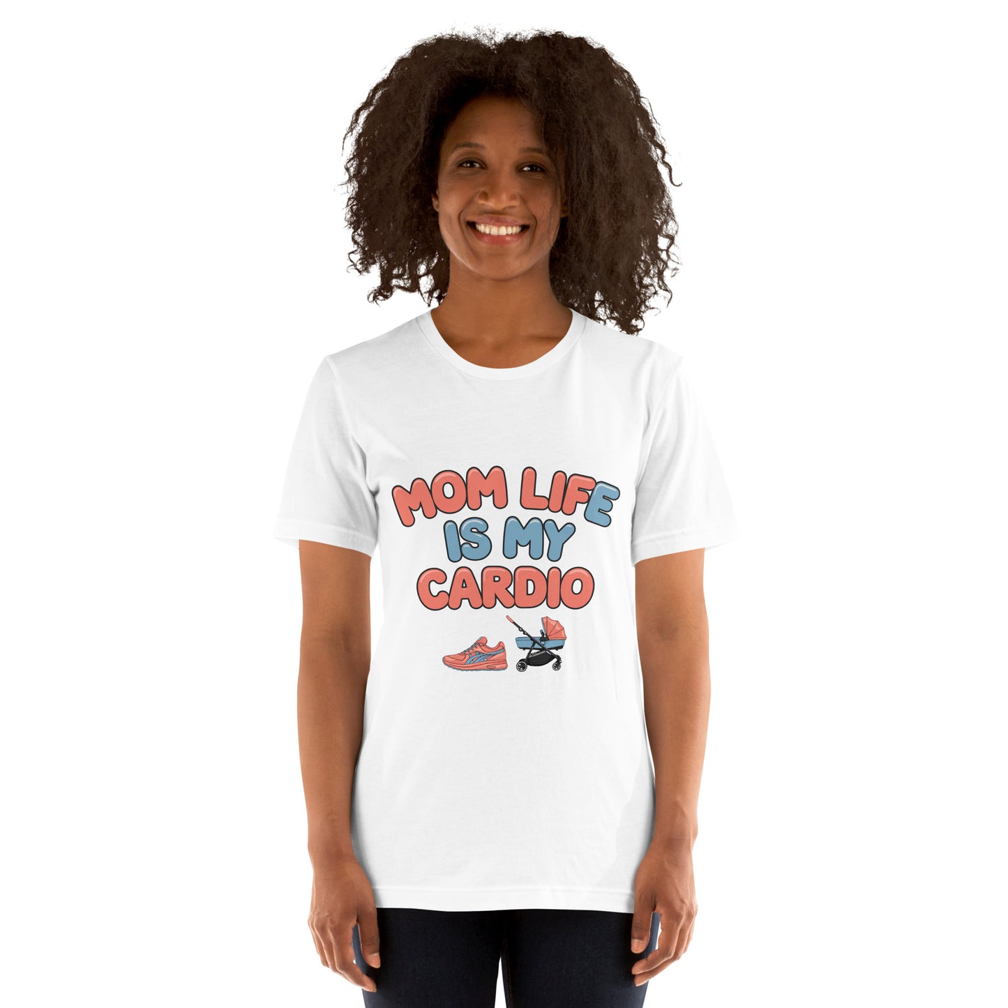 Smiling woman wearing a white unisex t-shirt with pastel text that says 'Mom Life Is My Cardio' and graphics of sneakers and a pacifier, standing against a white background.